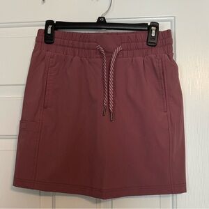 Avalanche athletic skort with pockets. Has built in spandex shorts.